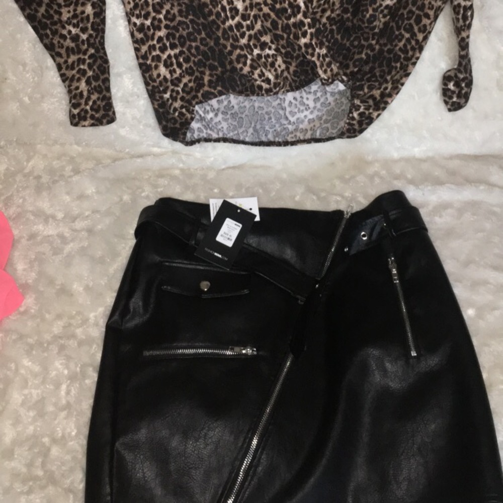 You have a leather skirt and a leopard shirt